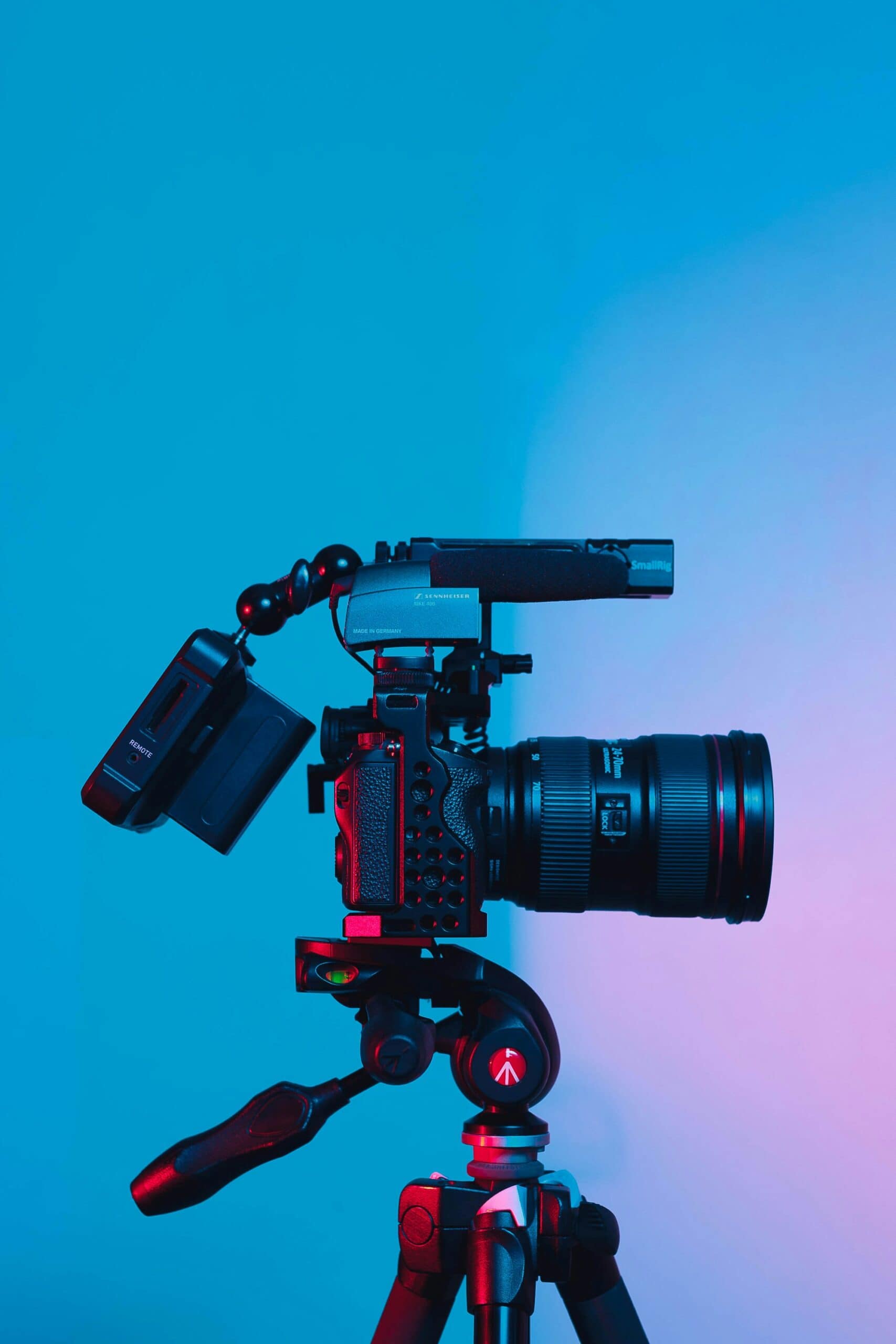 A camera on a tripod with a microphone attached