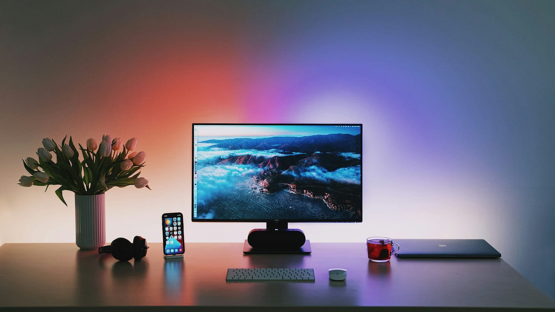 A monitor on a wooden desk